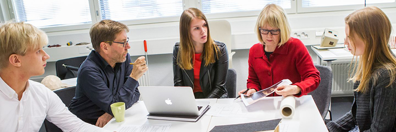 A group of women sitting at a table

Description automatically generated